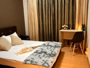 comfortable double bedroom at the Yew Mei Green condo